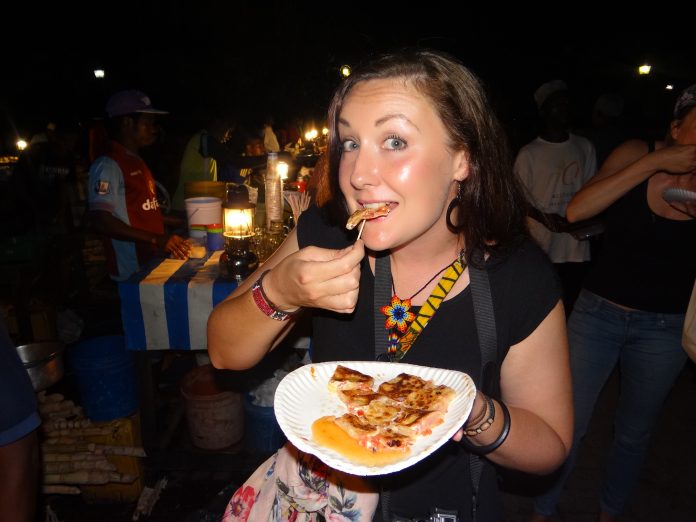 Eating a Zanzibar Pizza at Forodhani Gardens in Stone Town, Zanzibar. Kenya and Tanzania Itinerary.