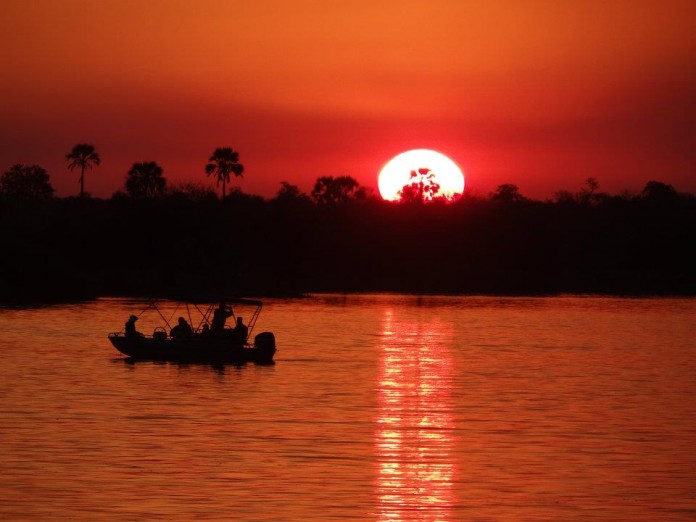 The Beginner's Guide to Backpacking East & Southern Africa - Sunset over the Zamzezi River