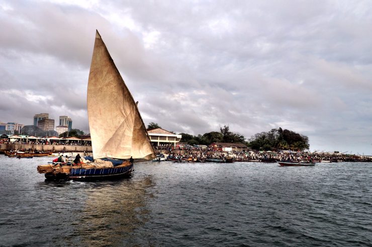 Tradirional dhow sailing into Dar es Salaam Harbour. Kenya and Tanzania Itinerary.