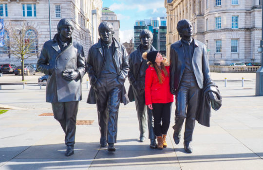 Helen in Wonderlust at the Beatles Statue in Liverpool