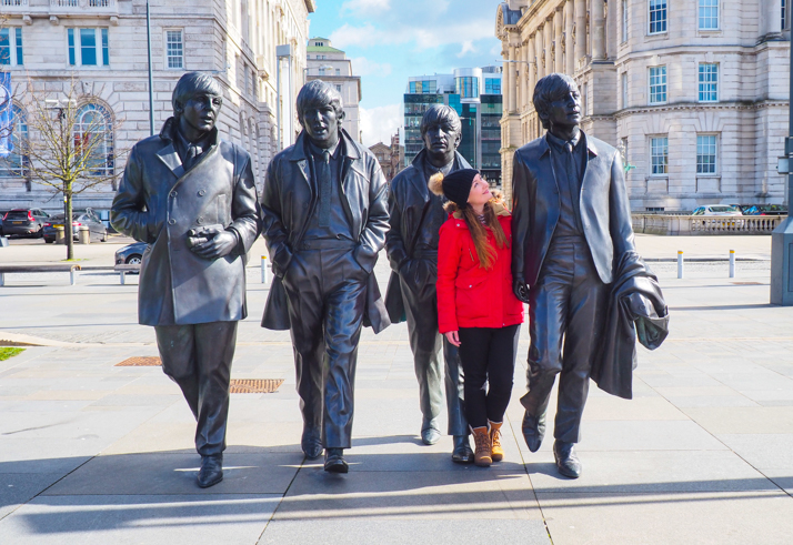 Helen in Wonderlust at the Beatles Statue in Liverpool