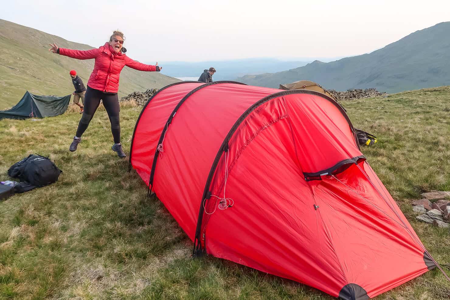 Putting up the tent whilst wild camping in the Lake District.