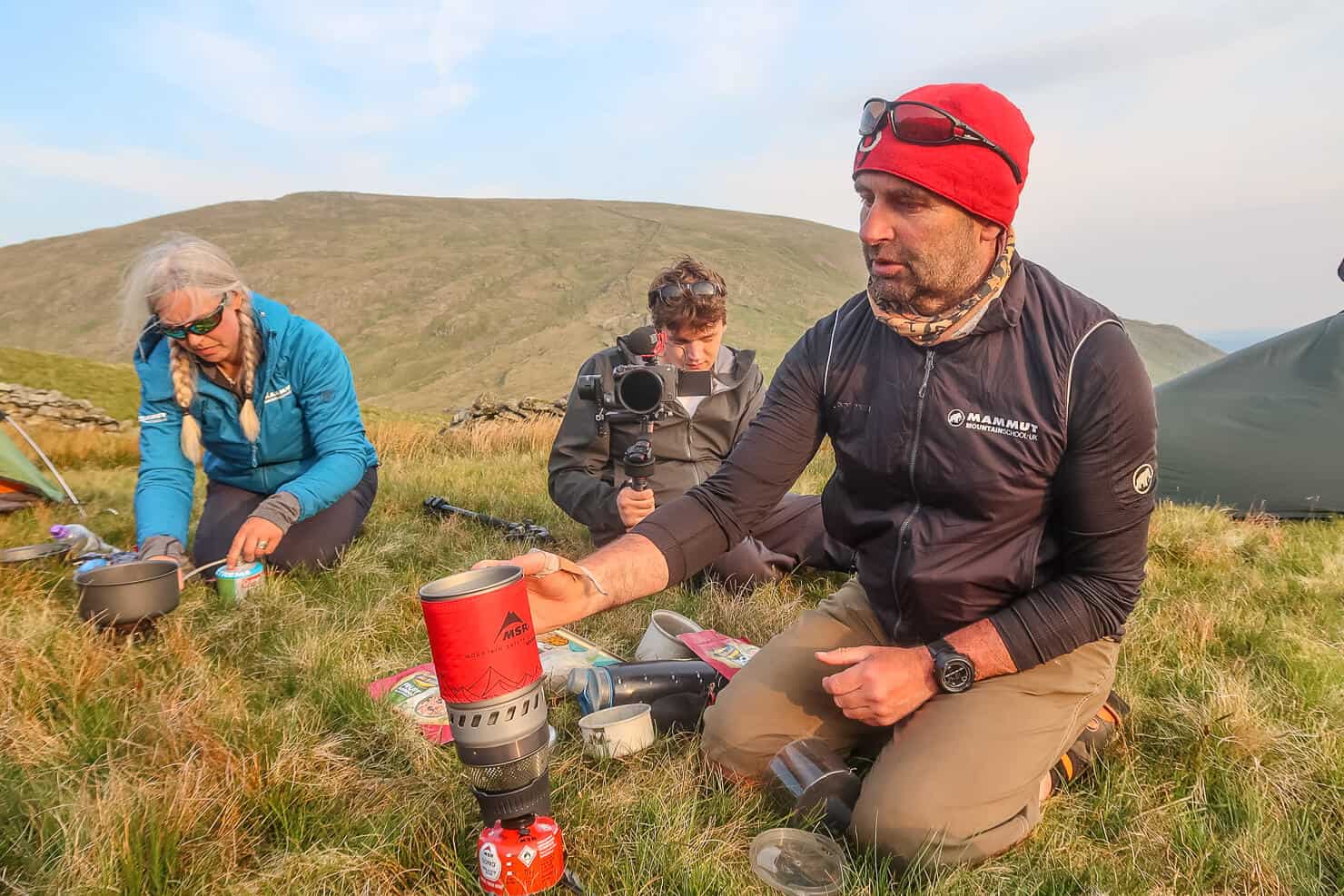 Learning to use a camping stove whilst wild camping in the Lake District.