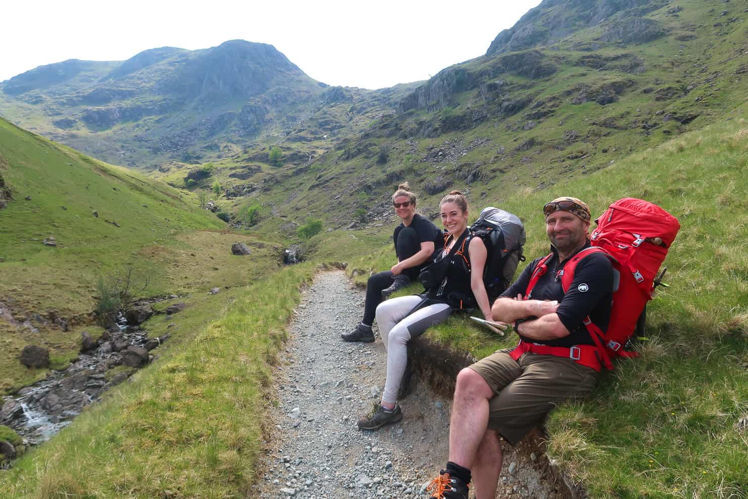 3 hikers having a rest in the Lake District.